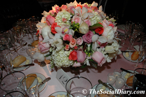 candlelight ball centerpiece of various shades of pink roses